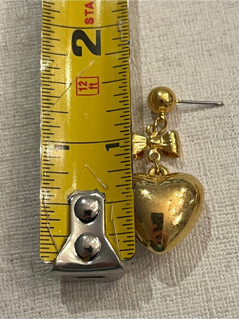 Vintage gold tone bow and puffy heart dangle earrings. So sweet!